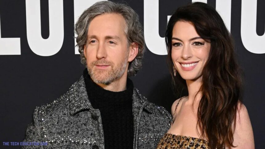 Anne Hathaway (R) and Adam Shulman attend the Valentino Haute Couture Spring Summer 2023 show as part of Paris Fashion Week on January 25, 2023 in Paris, France