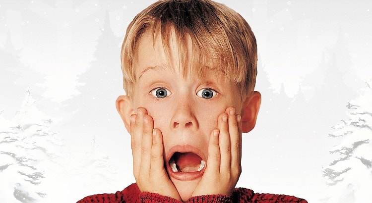 Macaulay Culking as Kevin McCallister on the poster for the first Home Alone movie, released in 1990